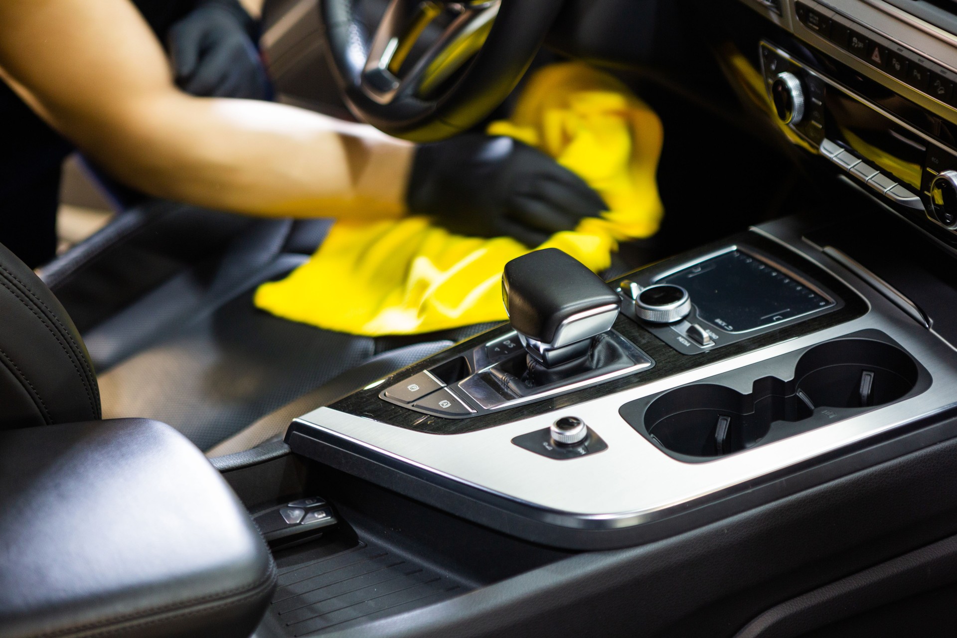 Man cleaning upholstery of his vehicle